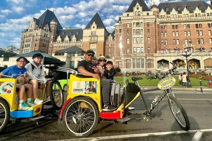 a group of people riding in a pedicab