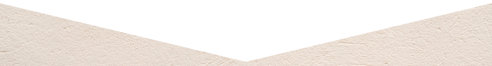 Green triangle above beige background with textured surface.